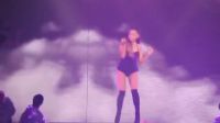 Ariana Grande shaking her ass in high heel boots.