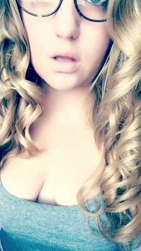 Teasing With Long Curls And Glasses