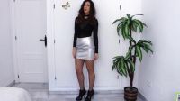 Posing In Silver Skirt And Fishnets