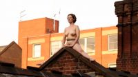 Performance Artist Naked On The Roof