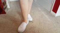 Red Toes Slipping Out Of White Shoes